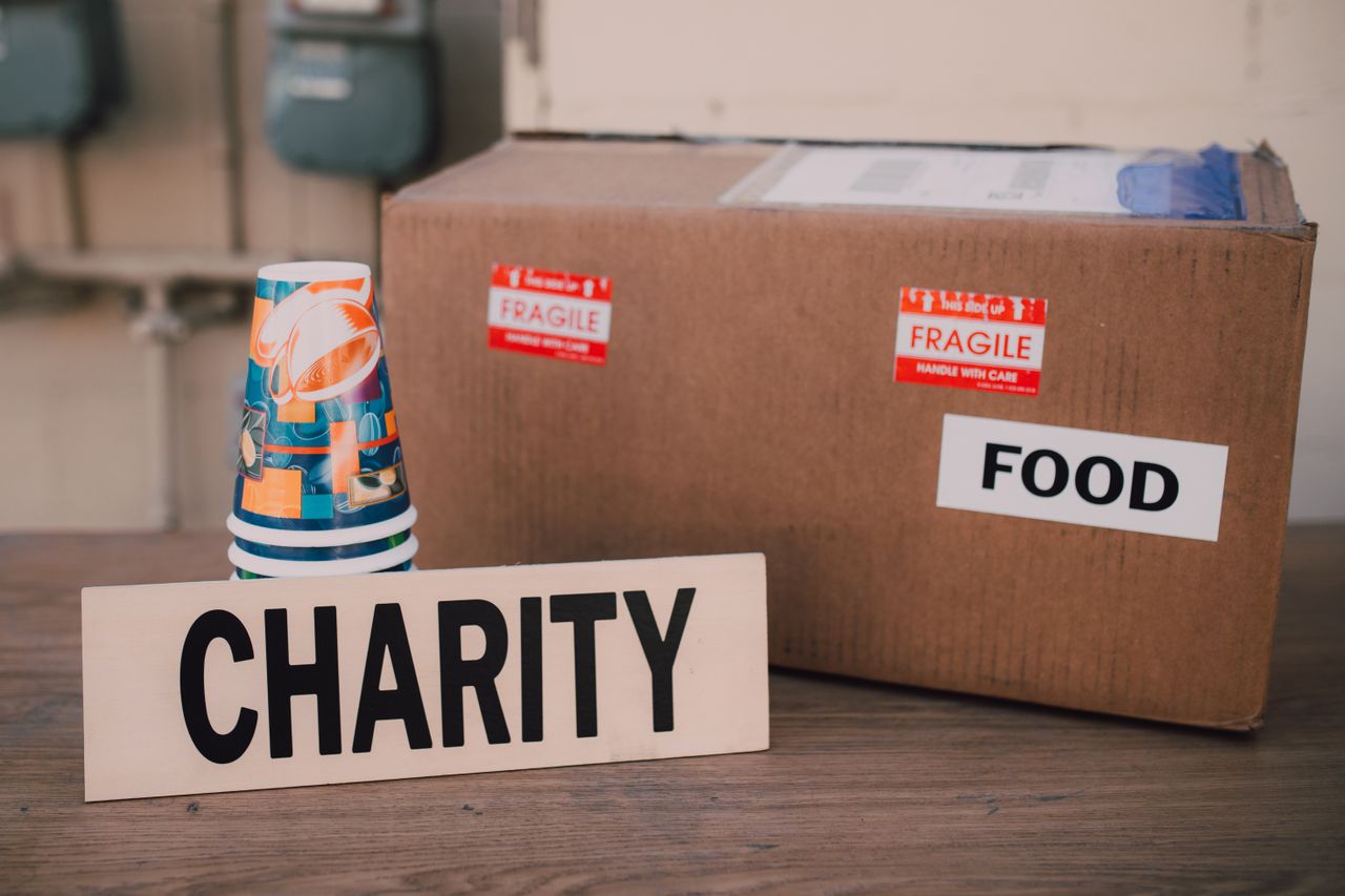 Mastering the First Impression: Your intriguing post title goes here Image of a charity donation box filled with food supplies and paper cups.